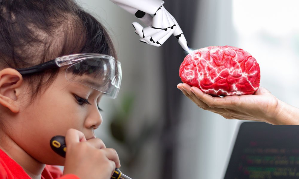 A young girl in Science/Tech class handing a tool as a robotic arm points to a simulated brain